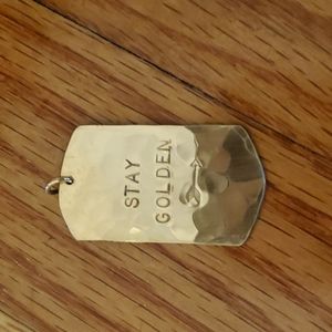 James Michelle "Stay Golden" (it's called a dog tag).  Charm